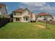 Large back yard with grass and a patio area that's perfect for entertaining at 1801 Deer Crossing Cir, Jonesboro, GA 30236