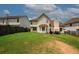 Back yard area with a large green lawn and outdoor seating at 1801 Deer Crossing Cir, Jonesboro, GA 30236