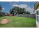 Expansive backyard featuring a basketball hoop, storage shed, and a privacy fence, ideal for recreation and storage at 1801 Deer Crossing Cir, Jonesboro, GA 30236