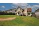 Spacious backyard features a patio area, lush lawn, and fenced perimeter, perfect for outdoor activities and relaxation at 1801 Deer Crossing Cir, Jonesboro, GA 30236