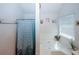 Bright bathroom features a shower with modern patterned curtain and a soaking tub by the window at 1801 Deer Crossing Cir, Jonesboro, GA 30236
