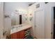 Updated bathroom features a long vanity, sink, cabinets, large mirror, and modern lighting at 1801 Deer Crossing Cir, Jonesboro, GA 30236