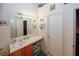 Updated bathroom with long vanity, sink, cabinets, large mirror, and modern lighting at 1801 Deer Crossing Cir, Jonesboro, GA 30236