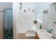 Bright bathroom features a large soaking tub, shower combination, a garden window, and neutral decor at 1801 Deer Crossing Cir, Jonesboro, GA 30236