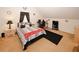 Comfortable bedroom features carpet, a comfortable bed, and a bedside table with lamp at 1801 Deer Crossing Cir, Jonesboro, GA 30236