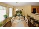 Inviting dining area with plants, bright lighting, and a breakfast bar creating an open atmosphere at 1801 Deer Crossing Cir, Jonesboro, GA 30236