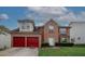 Charming two-story brick home featuring a two-car garage and well-manicured lawn at 1801 Deer Crossing Cir, Jonesboro, GA 30236