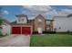 Lovely two-story brick home boasts a two-car garage, manicured lawn, and traditional architecture in a Gathering-friendly area at 1801 Deer Crossing Cir, Jonesboro, GA 30236
