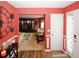 Welcoming foyer with hardwood flooring and a view to an open living room and front door at 1801 Deer Crossing Cir, Jonesboro, GA 30236