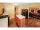 Bright kitchen with a center island, stainless steel refrigerator, and open view to the living area at 1801 Deer Crossing Cir, Jonesboro, GA 30236