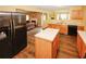 Updated kitchen with a center island, stainless steel refrigerator and hardwood floors at 1801 Deer Crossing Cir, Jonesboro, GA 30236