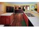 Open kitchen with island, stainless refrigerator and view to Gathering room; ideal for entertaining at 1801 Deer Crossing Cir, Jonesboro, GA 30236