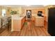 Spacious kitchen with light wood cabinets, a breakfast bar, and an open view to the dining area, perfect for cooking and dining at 1801 Deer Crossing Cir, Jonesboro, GA 30236