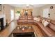 Relaxing living room featuring a fireplace, comfortable seating, and access to the backyard at 1801 Deer Crossing Cir, Jonesboro, GA 30236