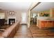 Cozy living room featuring a fireplace and seamless flow to the kitchen at 1801 Deer Crossing Cir, Jonesboro, GA 30236