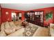 Cozy living room with comfortable seating, elegant display cabinet, and open access to dining room at 1801 Deer Crossing Cir, Jonesboro, GA 30236