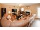 Inviting living room with a fireplace, leather seating, and plenty of space for relaxation and social gatherings at 1801 Deer Crossing Cir, Jonesboro, GA 30236