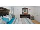 Comfortable main bedroom features nice bedding and modern furniture and decor at 1801 Deer Crossing Cir, Jonesboro, GA 30236