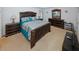 Spacious bedroom showcasing dark wood bedroom set and ample natural light at 1801 Deer Crossing Cir, Jonesboro, GA 30236