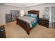 Spacious main bedroom featuring a tray ceiling and an ensuite bathroom at 1801 Deer Crossing Cir, Jonesboro, GA 30236
