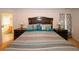Primary bedroom featuring a plush bed with decorative pillows and side tables at 1801 Deer Crossing Cir, Jonesboro, GA 30236