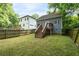 Spacious backyard with a wooden fence, offering privacy and room for outdoor activities at 3111 Jones St, East Point, GA 30344