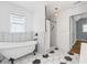 Stylishly remodeled bathroom with hexagon floors and subway tile at 3111 Jones St, East Point, GA 30344