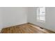 Bright bedroom featuring hardwood flooring and a window providing ample natural light at 3111 Jones St, East Point, GA 30344