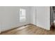 Bright bedroom featuring hardwood flooring and a window providing ample natural light at 3111 Jones St, East Point, GA 30344
