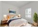 Bright bedroom with stylish decorations, bedside tables and lamps, creating a cozy and inviting atmosphere at 3111 Jones St, East Point, GA 30344
