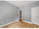 Empty bedroom with a large door and hardwood floors, providing a serene and private retreat at 3111 Jones St, East Point, GA 30344