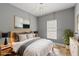 Stylish bedroom with a large mirror, lamps, and a bed with nightstands, creating a relaxing retreat at 3111 Jones St, East Point, GA 30344