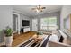Cozy living room features hardwood floors, natural light, a ceiling fan and neutral colors at 3111 Jones St, East Point, GA 30344