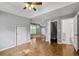 Open-concept living space with hardwood floors, neutral walls, and many doorways at 3111 Jones St, East Point, GA 30344