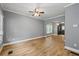 Bright living room features hardwood floors and a ceiling fan at 3111 Jones St, East Point, GA 30344