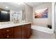 Beautiful bathroom with marble vanity, soaking tub, and modern fixtures at 57 Forsyth Nw St # 11G, Atlanta, GA 30303