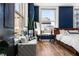 Cozy bedroom featuring a small couch, decor, and a large window at 57 Forsyth Nw St # 11G, Atlanta, GA 30303