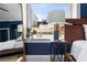 Bright bedroom featuring a small side table, decor, and large window at 57 Forsyth Nw St # 11G, Atlanta, GA 30303