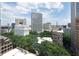 This cityscape features various architectural styles, showcasing green trees and a mix of modern and classic buildings at 57 Forsyth Nw St # 11G, Atlanta, GA 30303
