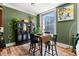 Charming dining area with wood floors, plenty of natural light, and city view at 57 Forsyth Nw St # 11G, Atlanta, GA 30303