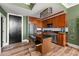 Well-lit kitchen with an island, stainless steel appliances, and wood cabinets at 57 Forsyth Nw St # 11G, Atlanta, GA 30303