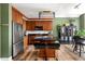 Modern kitchen features stainless steel appliances, wooden cabinets, a center island and a kitchen table at 57 Forsyth Nw St # 11G, Atlanta, GA 30303
