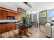 This open floor plan offers a kitchen and living space with views of city buildings through the window at 57 Forsyth Nw St # 11G, Atlanta, GA 30303