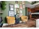 This living room showcases colorful decor, a decorative fireplace, and wall art next to the kitchen at 57 Forsyth Nw St # 11G, Atlanta, GA 30303