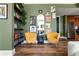 This living room features modern furniture, open space, and artful wall decor next to the kitchen at 57 Forsyth Nw St # 11G, Atlanta, GA 30303