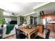 Open-concept living space with modern furnishings and stylish decor, featuring a dining table and kitchen at 57 Forsyth Nw St # 11G, Atlanta, GA 30303