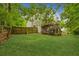 Expansive backyard featuring a wooden fence and view of the deck at 111 Trellis Ct, Acworth, GA 30101