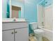Light blue bathroom featuring white toilet, tub/shower combo, and vanity with a chrome faucet at 111 Trellis Ct, Acworth, GA 30101