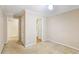 Neutral bedroom featuring carpeted floor, single light fixture, and doorway to the rest of the home at 111 Trellis Ct, Acworth, GA 30101
