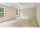 Bright bedroom featuring natural light from two windows and a neutral color scheme at 111 Trellis Ct, Acworth, GA 30101